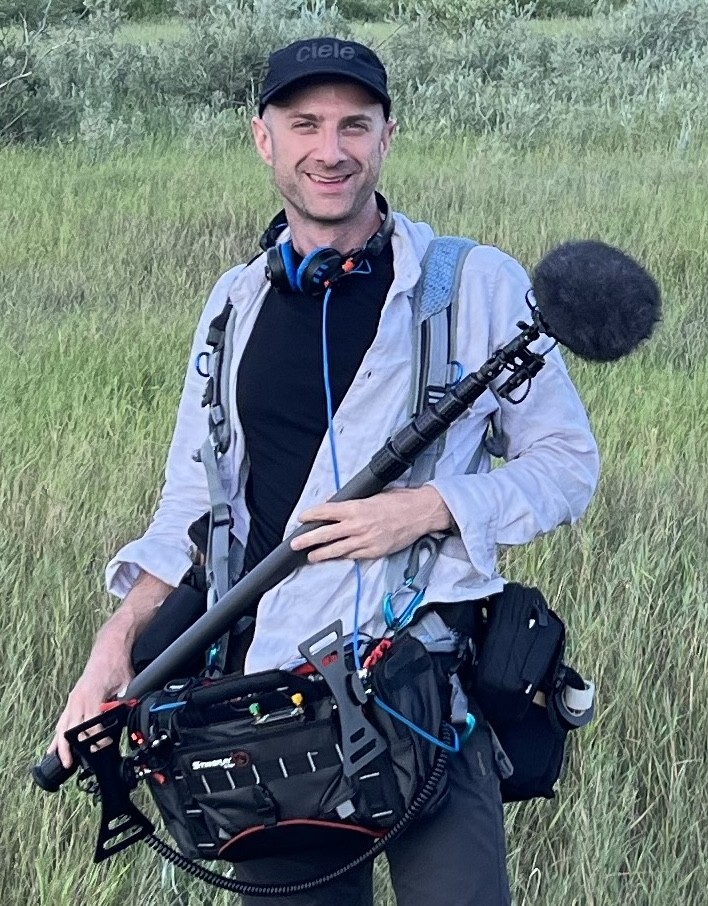 Jordan Moser, New York production sound mixer, on location with a boom mic and sound bag